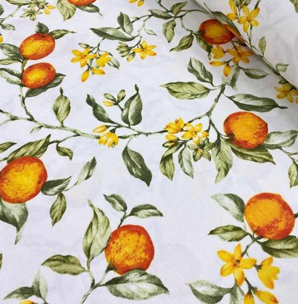 Orange tree patterned upholstery curtain fabric with yellow flowers and green leaves on a white background.
