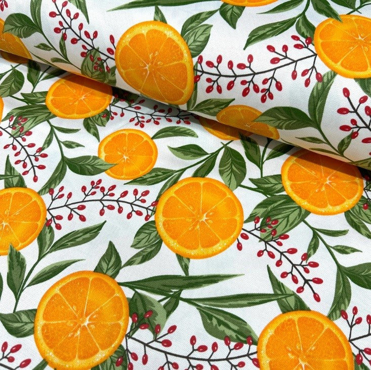 Summer orange fruits and green leaves printed on white cotton canvas fabric