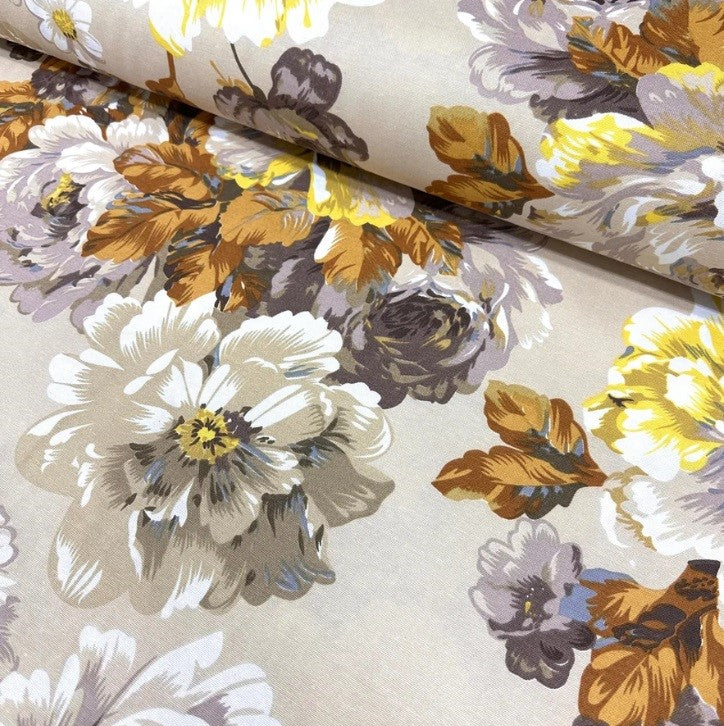 Cotton canvas fabric printed with beige brown yellow flowers and leaves