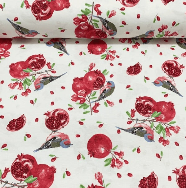 Patterned upholstery fabric with red pomegranates and grey birds on a white background.