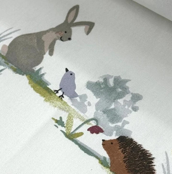 Rabbit, bird, hedgehog and flower print fabric.