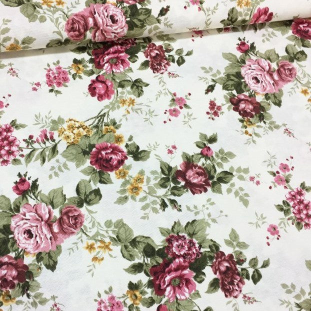 Vintage style floral garden upholstery fabric patterned with burgundy roses and sage green leaves.