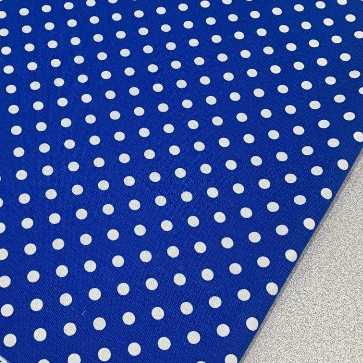 Royal blue and white spotty fabric for upholstery, soft furnishing and home decor.