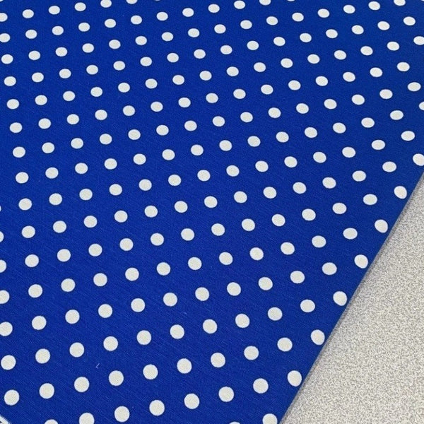 Royal blue and white spotty fabric for upholstery, soft furnishing and home decor.