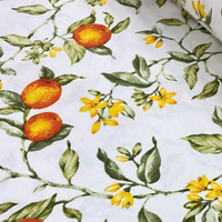 Orange citrus, green leaves and yellow blossoms patterned cotton canvas upholstery fabric.