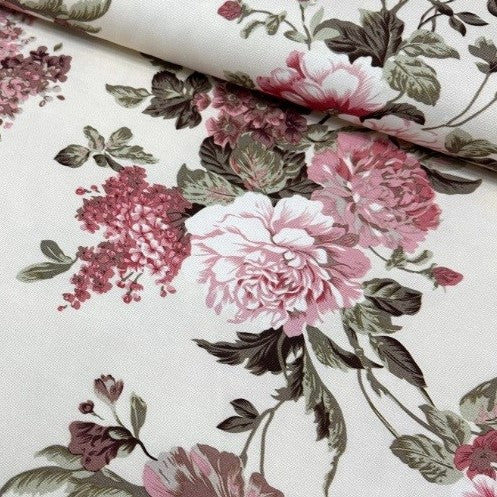 Pink peony flowers and sage green leaves patterned cream upholstery curtain fabric.