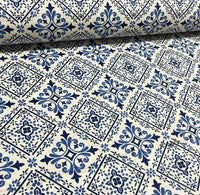 Blue, navy and white tile patterned cotton canvas fabric with geometric shapes and ornaments.