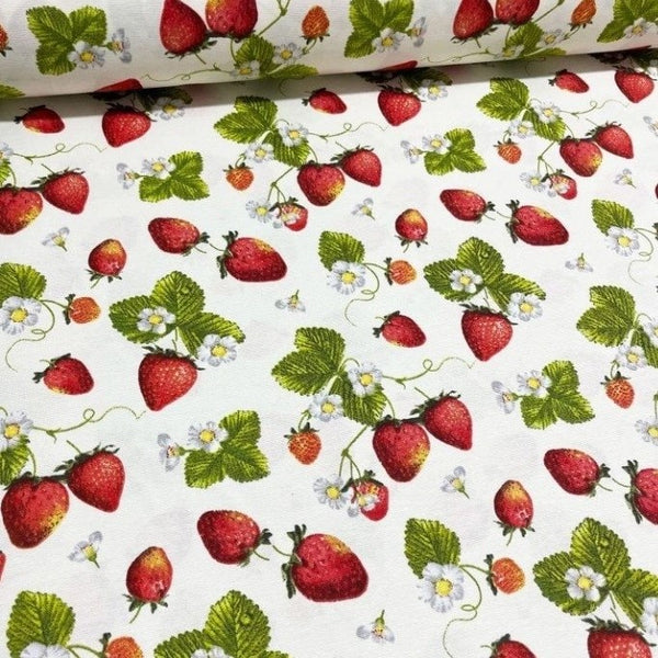 Red strawberries, white flowers and green leaves printed on white cotton canvas upholstery fabric.