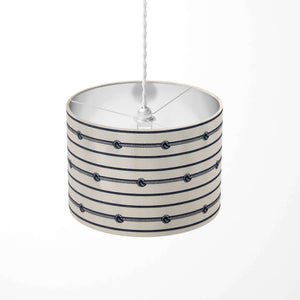 Vertical striped pendant light shade with rope design on a white background.