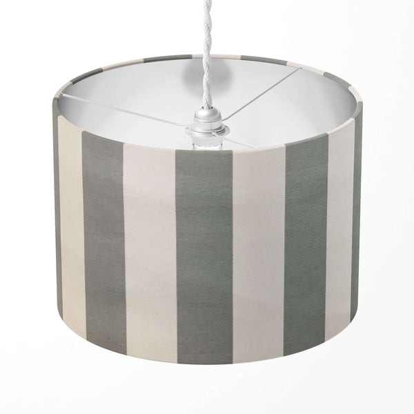 Striped lampshade with gray and white vertical stripes on a white background.