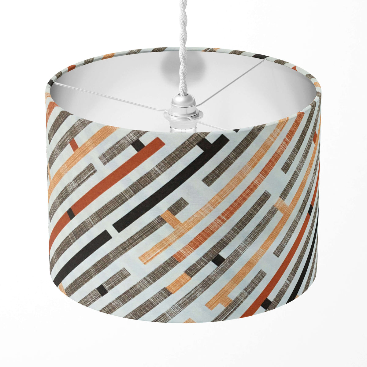 A stripe lampshade with brick red, orange, brown, black and white  geometric maze pattern for table and floor lamps, ceiling pendants.