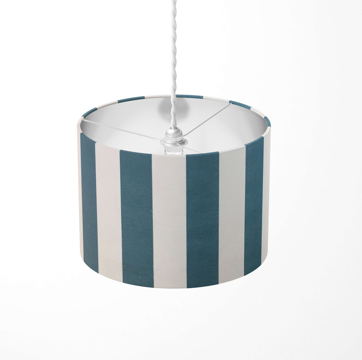 Vertical large striped ceiling lampshade with petrol blue and white pattern on a white background.