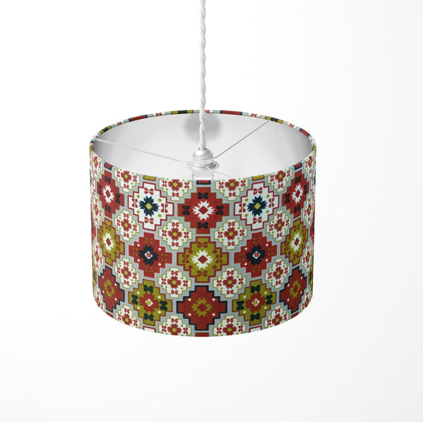 Decorative ceiling lampshade with a colorful aztec tribal pattern on a white background.