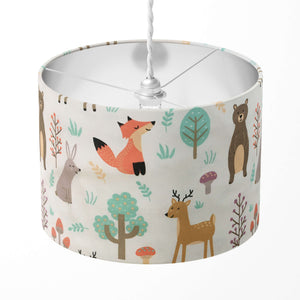 Woodland animal lampshade featuring fox, rabbit, reindeer, bear, tree and mushroom patterns.