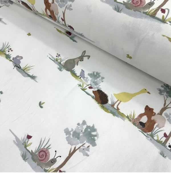 Woodland aimal upholstery fabric featuring rabbit, goose, hedgehog, squirrel.