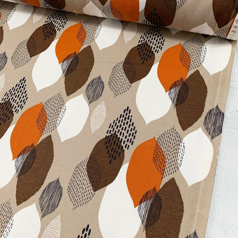 Contemporary curtain fabric featuring a geometric pattern with orange, brown, and white colors.