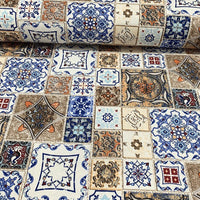 Ceramic fabric with a mosaic tile pattern featuring geometric designs in blue and brown.